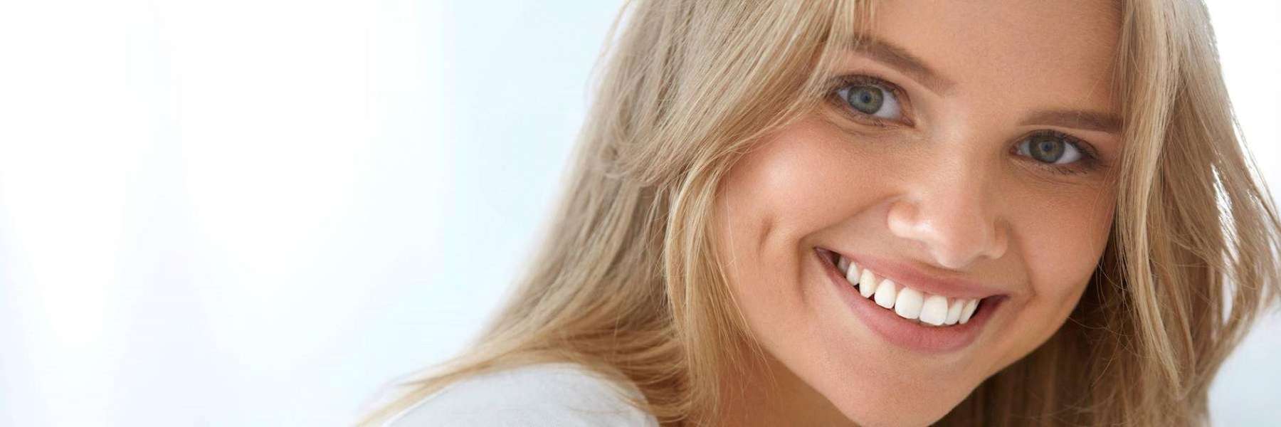 woman smiling after cosmetic dentistry services