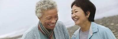 two women laughing on beach in mount waverley
